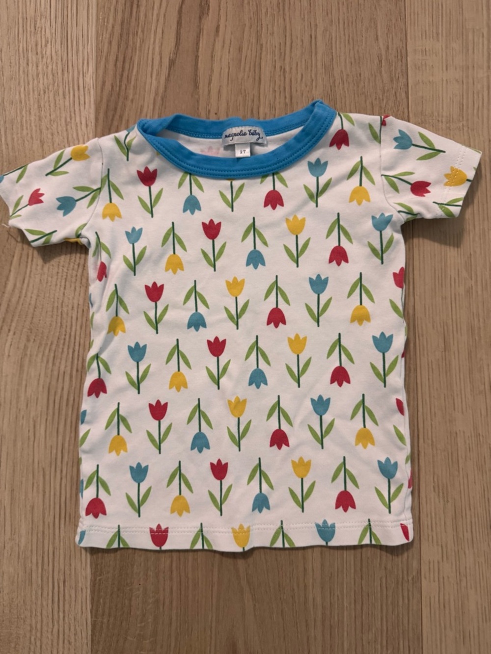 Magnolia Baby tulip-print kids tee in white with blue trim